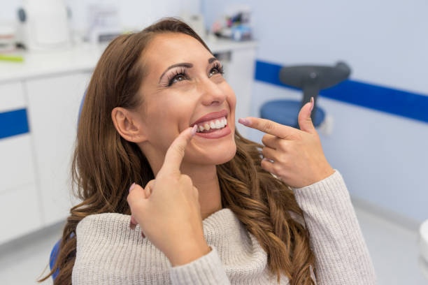 A woman showing off her pearly whites in our Salisbury dental center.